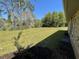 Large backyard offering generous green space and sprinkler system, perfect for outdoor activities at 1275 Man O War Dr, Deland, FL 32724