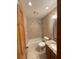 Cozy bathroom features a bathtub and shower combination, wood cabinet sink, and decorated walls at 1275 Man O War Dr, Deland, FL 32724