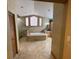 Bright bathroom features a soaking tub beneath three windows, with walk-in shower and double vanity sinks at 1275 Man O War Dr, Deland, FL 32724