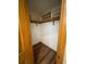 Walk-in closet with wood floor and built-in shelves at 1275 Man O War Dr, Deland, FL 32724