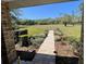 View of the beautiful, brick-paved front porch with brick columns and landscaped garden leading to the home at 1275 Man O War Dr, Deland, FL 32724