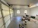 Spacious garage with open door, window, and ample space for storage and vehicles at 1275 Man O War Dr, Deland, FL 32724