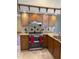 Charming kitchen features granite countertops, stainless steel appliances, and decorative tile backsplash at 1275 Man O War Dr, Deland, FL 32724
