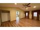 Bright living room with hardwood floors and view of kitchen and vaulted ceilings at 1275 Man O War Dr, Deland, FL 32724