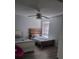 Comfortable bedroom featuring ceiling fan and a large window, offering natural light at 1416 Aguacate Ct, Orlando, FL 32837