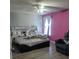 Comfortable bedroom with laminate flooring, a ceiling fan, and lots of natural light at 1416 Aguacate Ct, Orlando, FL 32837