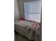 Small bedroom with window providing natural light at 1416 Aguacate Ct, Orlando, FL 32837