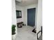 Bright entryway with sleek marble floors, a modern door, mirror, and shoe rack at 1416 Aguacate Ct, Orlando, FL 32837