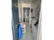 Well-lit laundry room including washer, dryer, storage shelves, and modern tiled floors at 1416 Aguacate Ct, Orlando, FL 32837