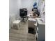 Functional office space with neutral tones, laminate flooring, and an oversized desk at 1416 Aguacate Ct, Orlando, FL 32837