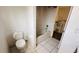 Standard bathroom with a toilet and a tiled bathtub with a shower head at 3965 Hampton Hills Rd, Lakeland, FL 33810
