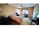 This is a Primary bedroom with a ceiling fan and plenty of natural light from the window at 3965 Hampton Hills Rd, Lakeland, FL 33810