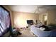 Bedroom with beige walls, a ceiling fan, and lots of natural light at 3965 Hampton Hills Rd, Lakeland, FL 33810