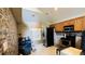 Kitchen featuring black appliances, wooden cabinets and tile flooring ready for renovation at 3965 Hampton Hills Rd, Lakeland, FL 33810