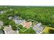 Beautiful aerial view of the home highlighting proximity to the woods at 1239 Roycroft Ave, Kissimmee, FL 34747
