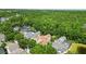 Beautiful aerial view of the home highlighting the terra cotta roof and proximity to the woods at 1239 Roycroft Ave, Kissimmee, FL 34747