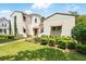 Charming two-story home with a tile roof and lush green lawn at 1239 Roycroft Ave, Kissimmee, FL 34747