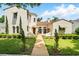 Stunning two-story home with a tile roof and a beautifully landscaped front yard at 1239 Roycroft Ave, Kissimmee, FL 34747