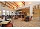 The clubhouse interior offers a restaurant and bar area with high ceilings and exposed wood beams at 1239 Roycroft Ave, Kissimmee, FL 34747