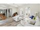 Spacious living room with open floor plan, hardwood floors, and double doors leading outside at 1239 Roycroft Ave, Kissimmee, FL 34747