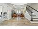 Bright and airy living room featuring stylish furnishings and wood-look tile flooring at 1239 Roycroft Ave, Kissimmee, FL 34747