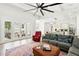 Open-concept floor plan with living room looking towards kitchen and doors to backyard at 1239 Roycroft Ave, Kissimmee, FL 34747