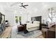 Main bedroom features French doors to backyard, tray ceilings and an ensuite bathroom at 1239 Roycroft Ave, Kissimmee, FL 34747
