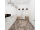 Walk-in closet with shelving, hangers and woven baskets for storage at 1967 Rider Rain Ln, Apopka, FL 32703