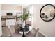 Cozy dining area features a round table with seating for four and views of the adjacent kitchen at 1967 Rider Rain Ln, Apopka, FL 32703