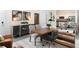 Open-concept living room flows into the kitchen with modern decor and stylish furnishings at 1967 Rider Rain Ln, Apopka, FL 32703