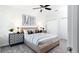 Tastefully decorated bedroom with a geometrically designed wall, plush carpeting, and modern decor at 1967 Rider Rain Ln, Apopka, FL 32703