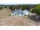 Aerial view of a well maintained single-Gathering home with an attached two car garage at 24025 Ranch Rd, Astatula, FL 34705