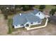 Aerial view of a well maintained single-Gathering home with an attached two car garage at 24025 Ranch Rd, Astatula, FL 34705