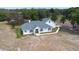 Aerial view of a well maintained single-Gathering home with an attached two car garage at 24025 Ranch Rd, Astatula, FL 34705