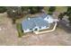 Aerial view of a well maintained single-Gathering home with an attached two car garage at 24025 Ranch Rd, Astatula, FL 34705