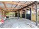 Barn interior with wood structure and concrete floor at 24025 Ranch Rd, Astatula, FL 34705