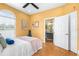Inviting bedroom with warm yellow walls, a ceiling fan, and an ensuite bathroom at 24025 Ranch Rd, Astatula, FL 34705