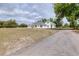 A white home on a large lot with mature trees and a long driveway at 24025 Ranch Rd, Astatula, FL 34705