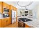 Stylish kitchen with stainless appliances, granite countertops, and an open layout to the living room at 24025 Ranch Rd, Astatula, FL 34705