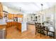 Spacious open-concept kitchen flows into the dining and living areas, featuring wood cabinets and an island at 24025 Ranch Rd, Astatula, FL 34705