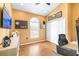 Bright office space with warm yellow walls, a vaulted ceiling, and herringbone floors at 24025 Ranch Rd, Astatula, FL 34705