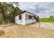 Small outbuilding with boarded up windows and yard at 24025 Ranch Rd, Astatula, FL 34705