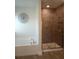 The luxurious bathroom features a glass-enclosed shower and a soaking tub at 4616 Grandview Glen Dr, Auburndale, FL 33823