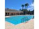 Enjoy this large community pool, surrounded by palm trees at 4616 Grandview Glen Dr, Auburndale, FL 33823