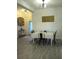 Cozy dining room with table setting, decorative wall art, and adjacent to a bright entryway at 4616 Grandview Glen Dr, Auburndale, FL 33823