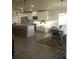 Stylish kitchen with granite countertops, stainless appliances, a kitchen island, and a dining area at 4616 Grandview Glen Dr, Auburndale, FL 33823
