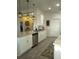 Modern kitchen featuring granite countertops, stainless steel appliances, and white cabinetry at 4616 Grandview Glen Dr, Auburndale, FL 33823