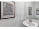 Elegant half-bathroom featuring a stylish sink, faucet, and modern decor at 606 Terrapin Dr, Debary, FL 32713