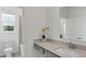 Bright bathroom features a modern vanity with white countertop and neutral color palette at 606 Terrapin Dr, Debary, FL 32713