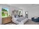 Bright bedroom with plush carpet, natural light, and a cozy atmosphere at 606 Terrapin Dr, Debary, FL 32713